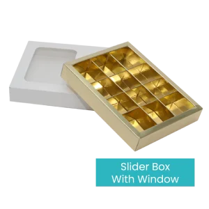 A gold, rectangular Chocolate Box with a window is displayed partially pulled out of its white sleeve. The interior is sectioned into small compartments, ideal for storing items like chocolates or jewelry. Text reads, "Chocolate Box With Window.